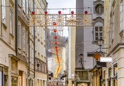 Low angle view of street light against building