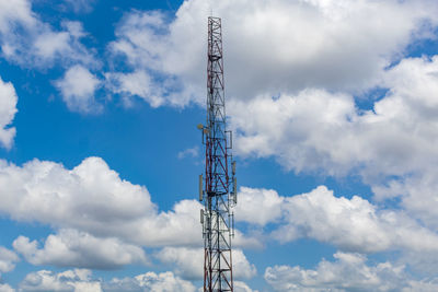 Low angle view of communications tower against sky