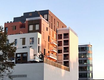 Low angle view of modern buildings against clear sky