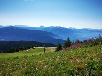 Scenic view of landscape and mountains against sky