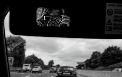 Reflection of camera in car mirror