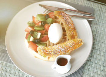 Close-up of breakfast served on table