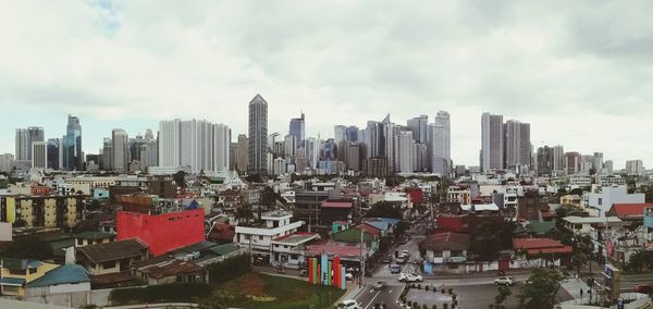 High angle view of buildings in city against sky