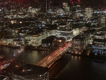 High angle view of illuminated city buildings at night