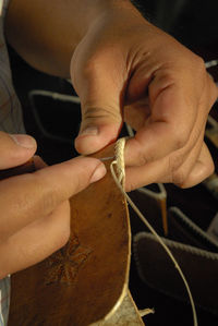 Close-up of man holding hands