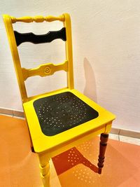 High angle view of arrow sign on wall