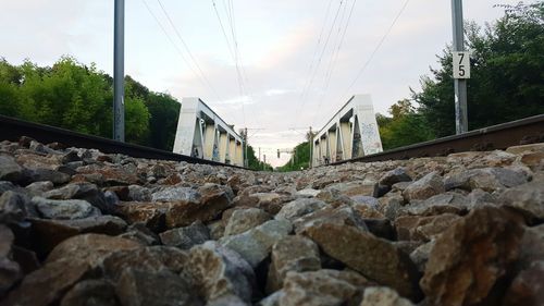 Surface level of railroad tracks against sky