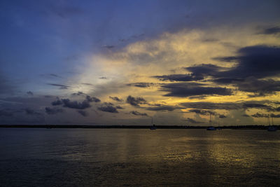 Scenic view of sea against dramatic sky