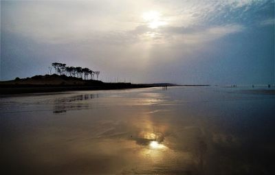 Scenic view of sea against sky at sunset