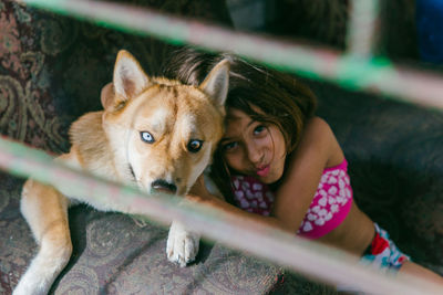 Portrait of young woman with dog