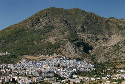 Aerial view of mountains against clear sky