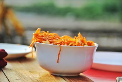 Close-up of orange juice on table