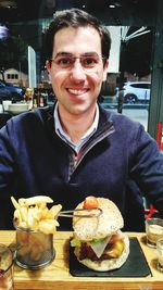 Portrait of smiling man with ice cream