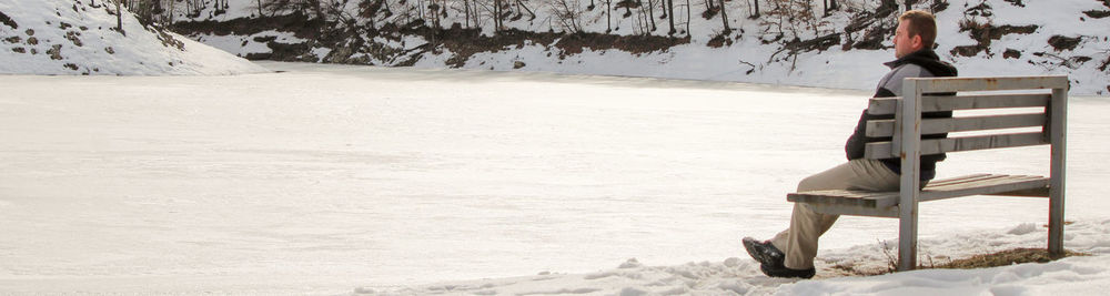 Man on snow covered land