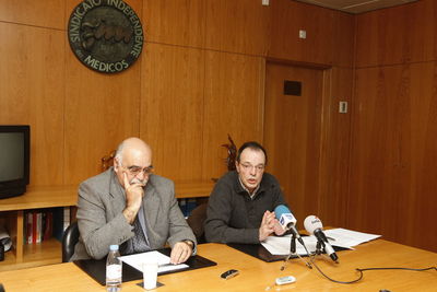 Man and woman sitting on table