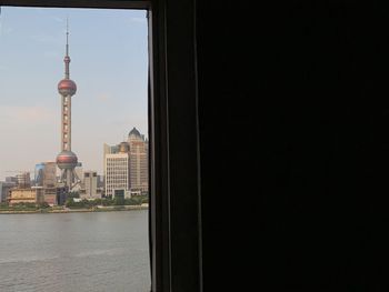 View of buildings in city against clear sky