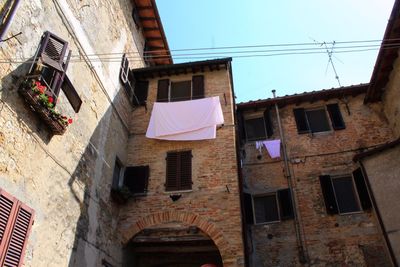 Low angle view of clothes drying on building