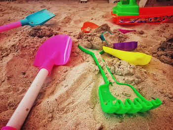 High angle view of toys on beach