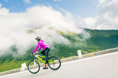 Man riding bicycle on mountain