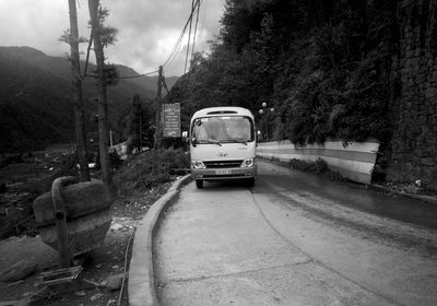 Cars on road against mountain