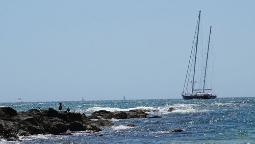 Sailboat sailing in sea