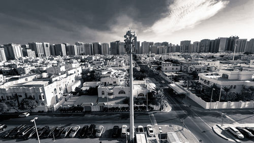 High angle view of city street and buildings against sky