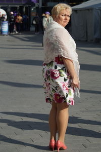 Full length of woman standing on street