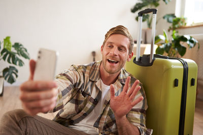 Portrait of woman using mobile phone