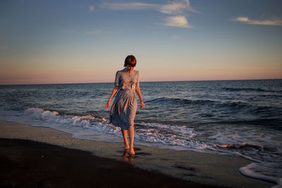 Scenic view of sea at sunset