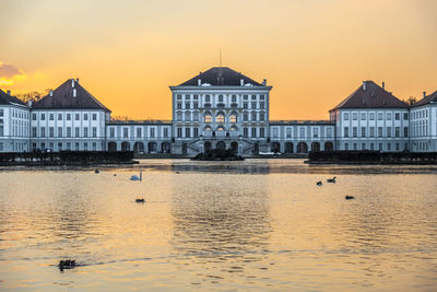 Buildings against sky during sunset