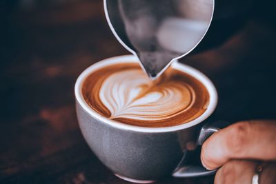 Cropped hand holding coffee