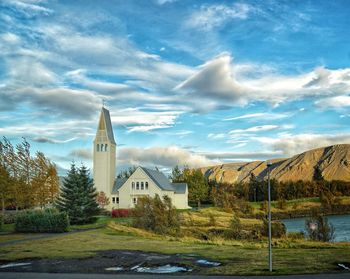 Trees and buildings against sky