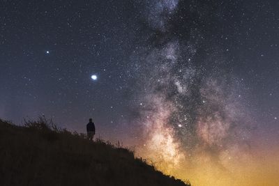 Scenic view of star field against sky at night