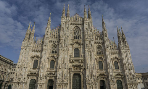 Low angle view of cathedral against cloudy sky