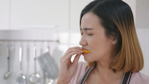 Portrait of woman holding ice cream