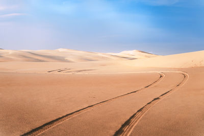 Scenic view of desert against sky