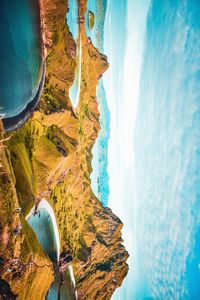 Panoramic view of sea and mountains against sky