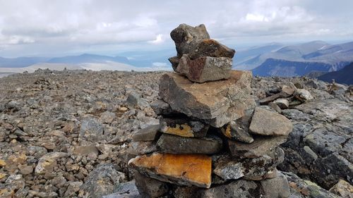 Stack of rocks against sky