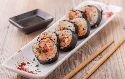 High angle view of korean rice roll in plate on table