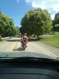 Man riding motorcycle on road