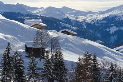 Scenic view of snow covered mountains against sky