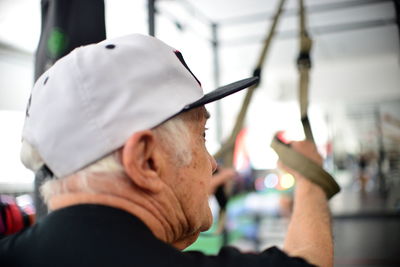 Side view of man holding camera