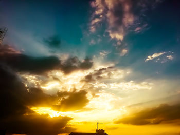 Low angle view of dramatic sky during sunset