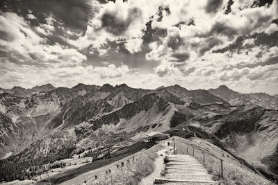 High angle view of mountain range against cloudy sky