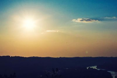 Scenic view of sunset over mountains