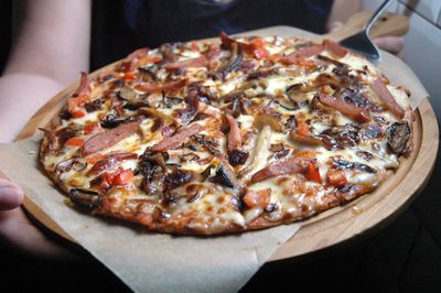 High angle view of pizza being served on table