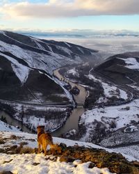 Scenic view of snow covered mountains