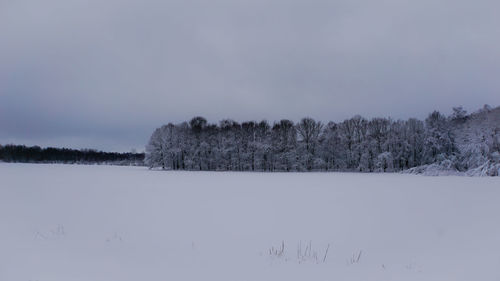 Scenic view of snow covered landscape against clear sky