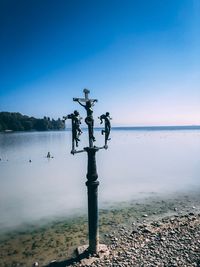 Scenic view of sea against clear blue sky