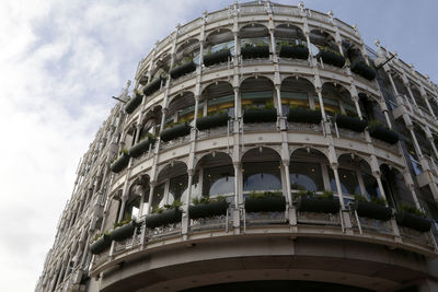 Low angle view of historical building against cloudy sky